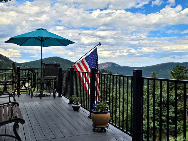 83 Wilderness Cornerstone Rd, Evergreen, CO 80439 - wooden terrace featuring a mountain view