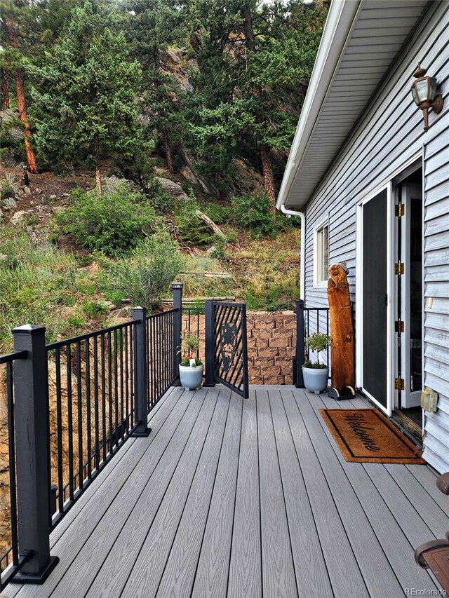 83 Wilderness Cornerstone Rd, Evergreen, CO 80439 - deck with french doors