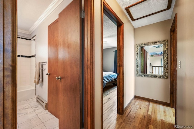 8386 S Davco Dr, Morrison, CO 80465 - hallway with ornamental molding, baseboards, and a baseboard heating unit
