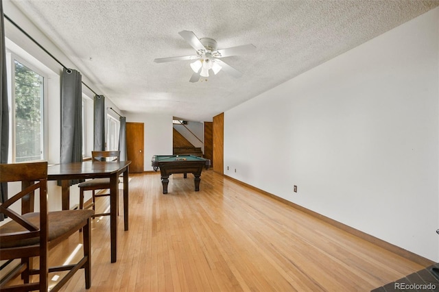 8386 S Davco Dr, Morrison, CO 80465 - playroom with a textured ceiling, pool table, light wood-style floors, ceiling fan, and baseboards