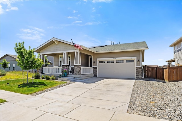 1925 Peregrine Dr, Brighton, CO 80601 - craftsman inspired home with a porch, a garage, stone siding, and concrete driveway