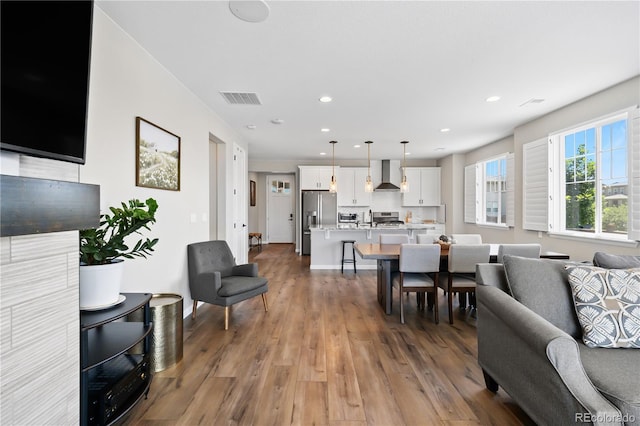 1925 Peregrine Dr, Brighton, CO 80601 - living room with light wood-style flooring and recessed lighting