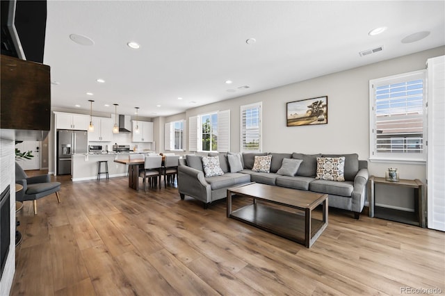 1925 Peregrine Dr, Brighton, CO 80601 - living room with light wood-style floors and recessed lighting