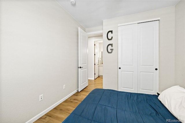 1925 Peregrine Dr, Brighton, CO 80601 - bedroom with wood finished floors and a closet