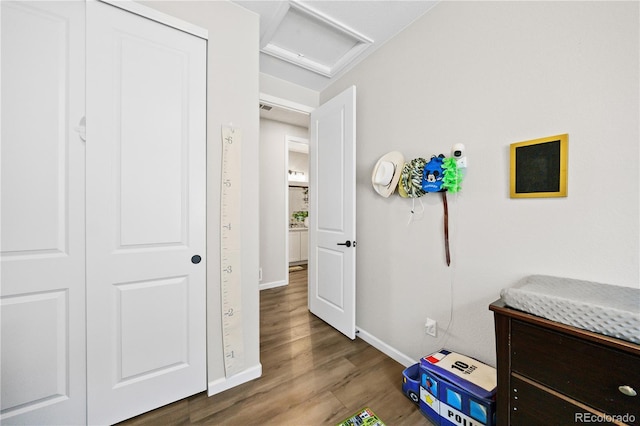 1925 Peregrine Dr, Brighton, CO 80601 - game room with attic access and wood finished floors