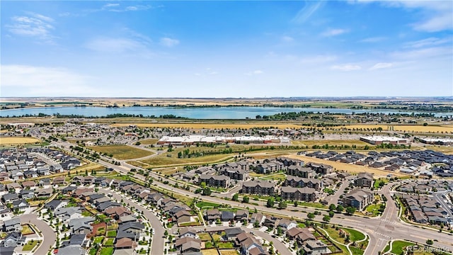 1925 Peregrine Dr, Brighton, CO 80601 - aerial view of property and surrounding area featuring nearby suburban area and a nearby body of water