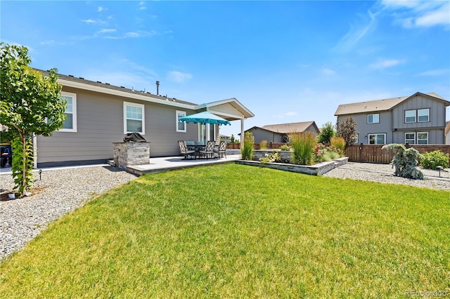 1925 Peregrine Dr, Brighton, CO 80601 - view of yard with a patio area