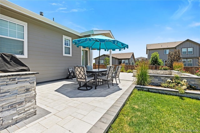 1925 Peregrine Dr, Brighton, CO 80601 - view of patio featuring a vegetable garden and outdoor dining space
