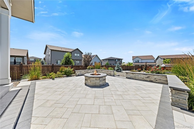 1925 Peregrine Dr, Brighton, CO 80601 - view of patio / terrace featuring an outdoor fire pit and a residential view