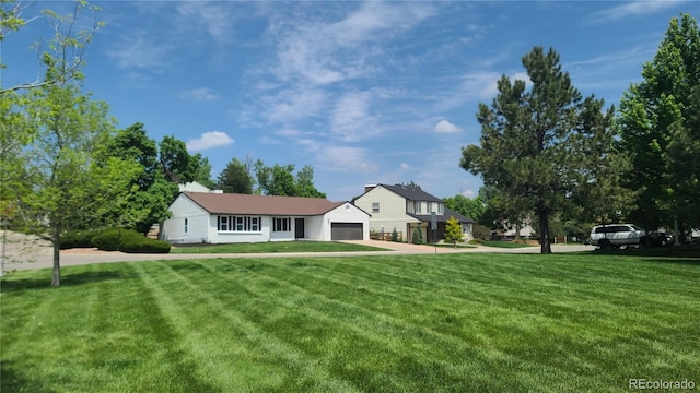 10297 W Crestone Mtn, Littleton, CO 80127 - view of front facade featuring a front lawn and an attached garage