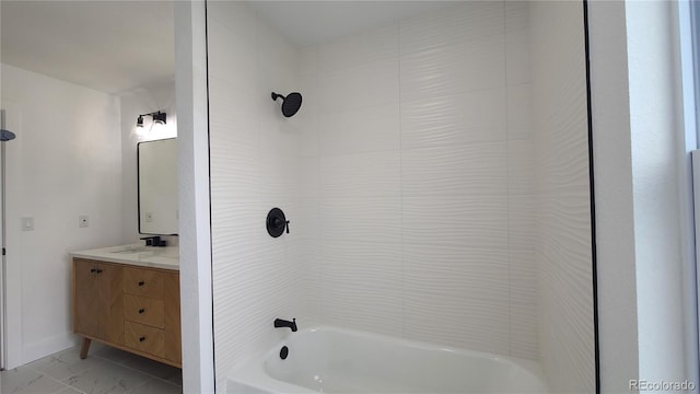10297 W Crestone Mtn, Littleton, CO 80127 - full bath featuring vanity, shower / bath combination, marble look tiles, and baseboards