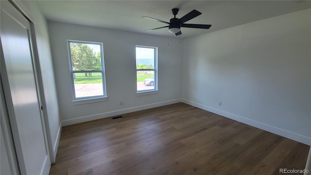10297 W Crestone Mtn, Littleton, CO 80127 - unfurnished room with wood finished floors, baseboards, and ceiling fan
