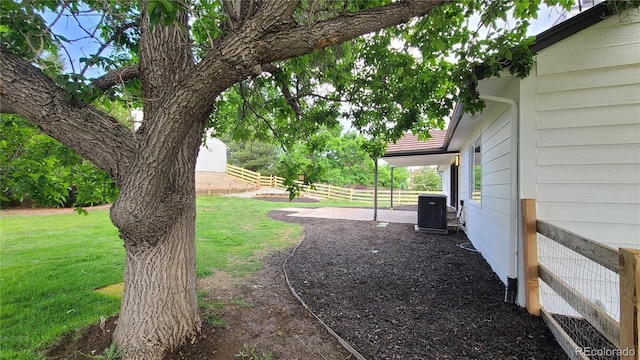 10297 W Crestone Mtn, Littleton, CO 80127 - view of yard featuring central air condition unit and a patio area