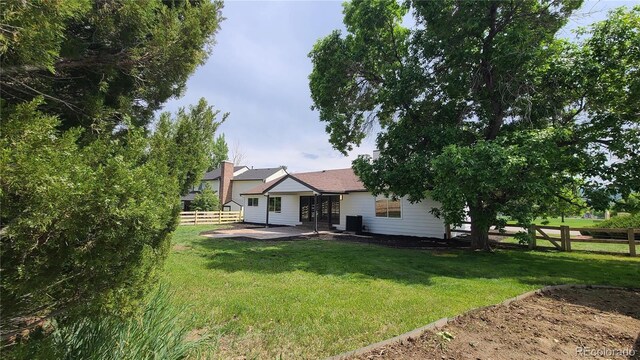 10297 W Crestone Mtn, Littleton, CO 80127 - view of yard featuring a patio