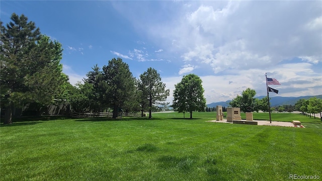 10297 W Crestone Mtn, Littleton, CO 80127 - view of green lawn with a mountain view