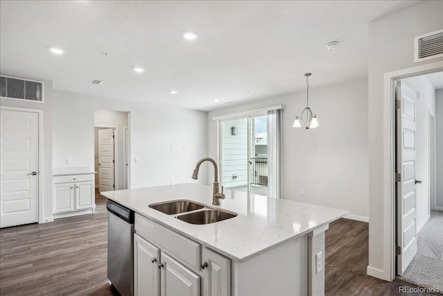 kitchen with dishwasher, visible vents, dark wood-style floors, and a sink