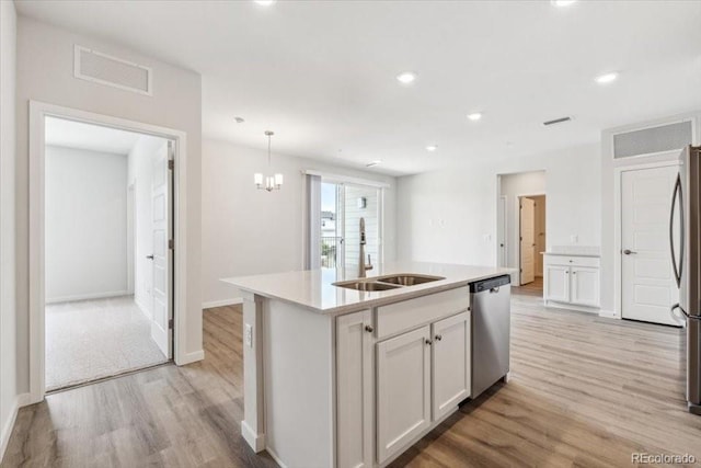 485 Interlocken Blvd Unit 209, Broomfield, CO 80021 - kitchen featuring a sink, appliances with stainless steel finishes, light wood-type flooring, white cabinets, and light countertops