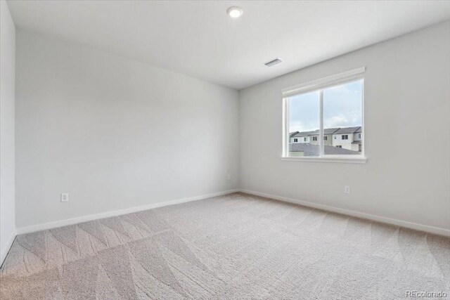 485 Interlocken Blvd Unit 209, Broomfield, CO 80021 - carpeted empty room featuring baseboards