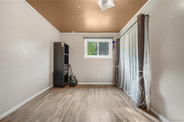 1777 Main St, Georgetown, CO 80444 - empty room featuring wood finished floors, baseboards, and crown molding