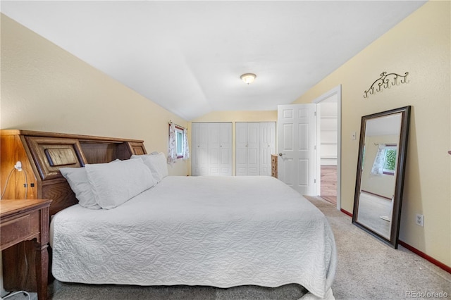 1777 Main St, Georgetown, CO 80444 - bedroom featuring multiple closets, light carpet, vaulted ceiling, and baseboards