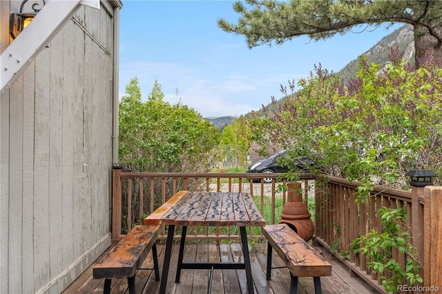 1777 Main St, Georgetown, CO 80444 - wooden deck featuring outdoor dining space and a mountain view