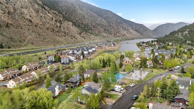 1777 Main St, Georgetown, CO 80444 - aerial overview of property's location featuring nearby suburban area and a water and mountain view