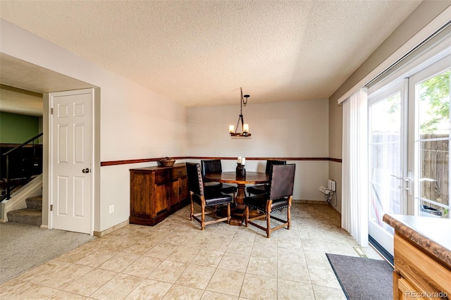 12632 W Virginia Ave, Lakewood, CO 80228 - dining room with a textured ceiling, stairs, a chandelier, and baseboards