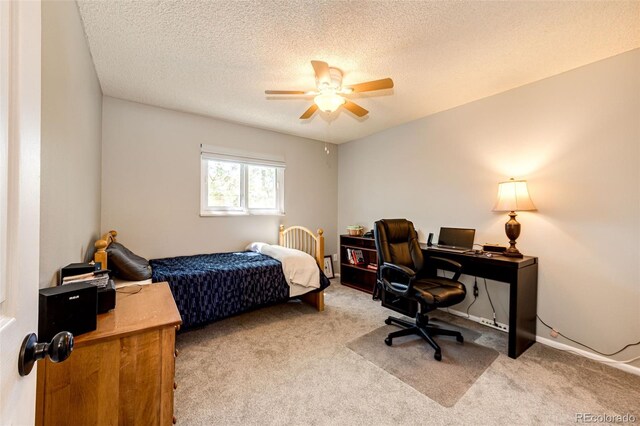 12632 W Virginia Ave, Lakewood, CO 80228 - carpeted bedroom with an office area, a textured ceiling, and ceiling fan