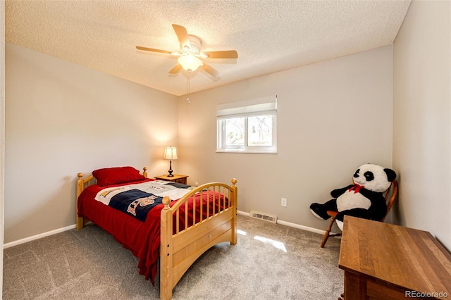 12632 W Virginia Ave, Lakewood, CO 80228 - carpeted bedroom with a textured ceiling, baseboards, and a ceiling fan