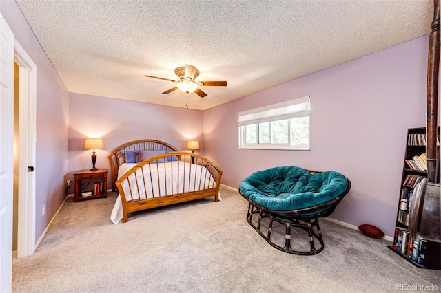 12632 W Virginia Ave, Lakewood, CO 80228 - bedroom featuring carpet floors, a textured ceiling, a ceiling fan, and baseboards