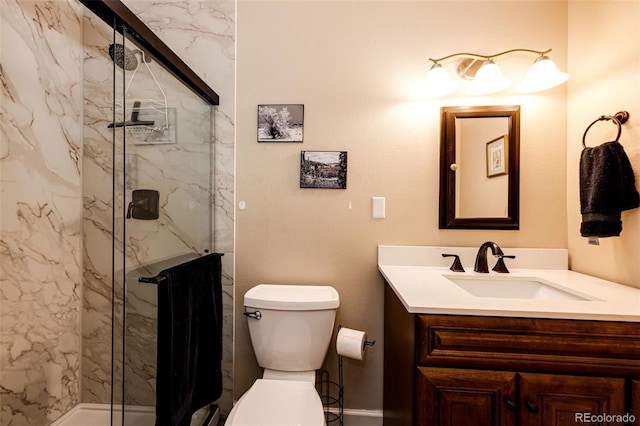12632 W Virginia Ave, Lakewood, CO 80228 - full bath featuring a marble finish shower, vanity, and toilet