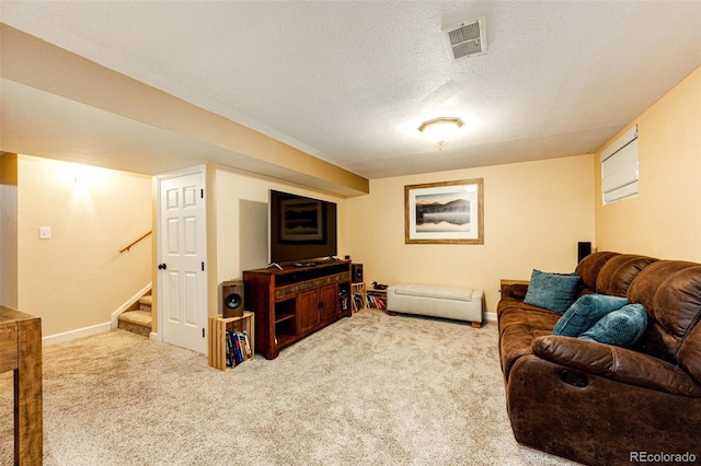 12632 W Virginia Ave, Lakewood, CO 80228 - living area with carpet floors, stairway, baseboards, and a textured ceiling