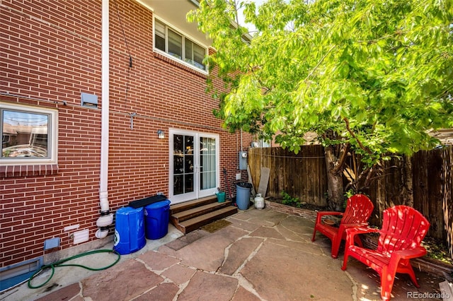 12632 W Virginia Ave, Lakewood, CO 80228 - view of patio / terrace featuring fence, french doors, and entry steps