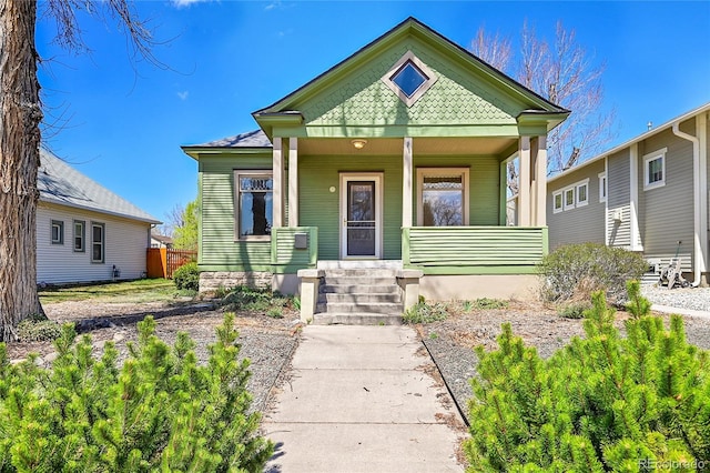 victorian house featuring covered porch