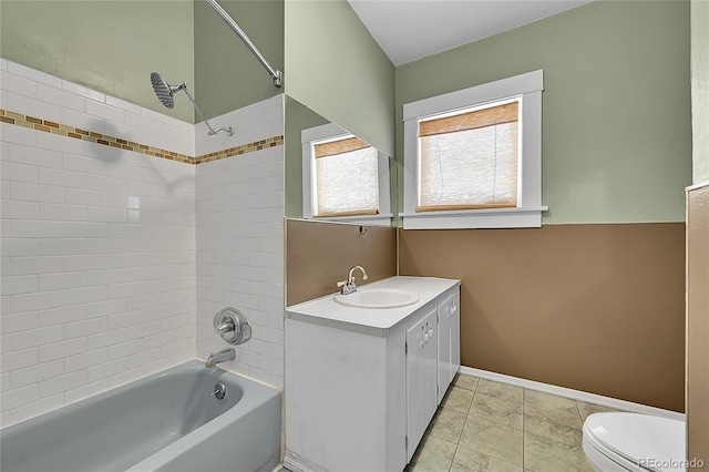 full bathroom with shower / bathtub combination, vanity, and toilet
