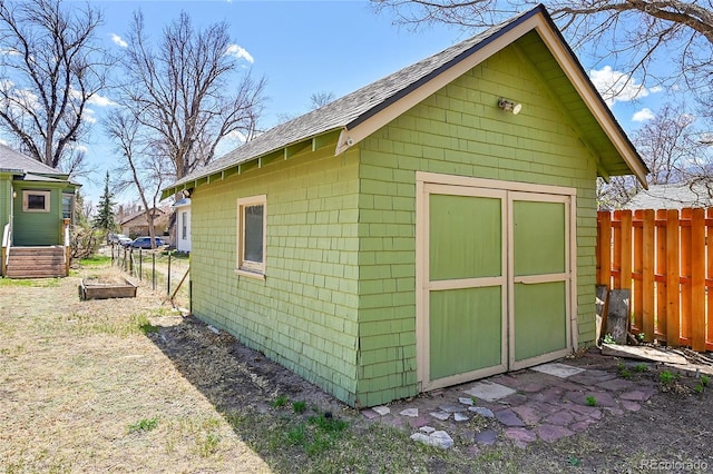 view of shed with fence