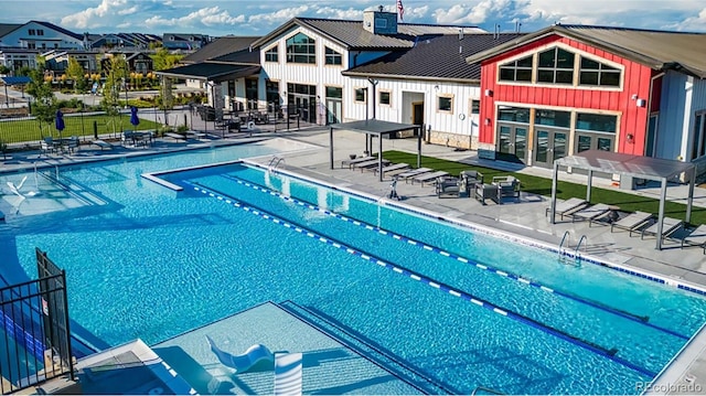 view of swimming pool featuring a patio area