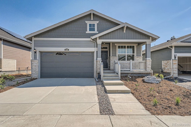 craftsman-style house with a garage and covered porch