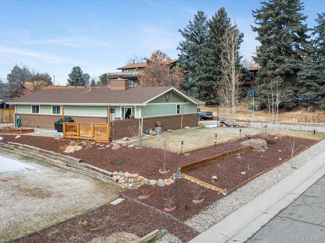 single story home featuring a deck