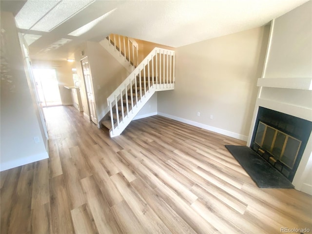 unfurnished living room featuring wood-type flooring