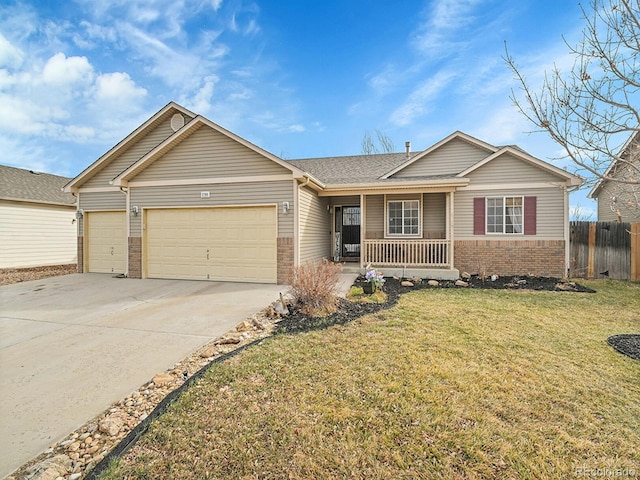 single story home featuring fence, covered porch, a front lawn, a garage, and brick siding