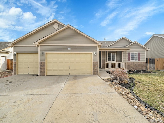 ranch-style house with a porch, fence, concrete driveway, a garage, and brick siding