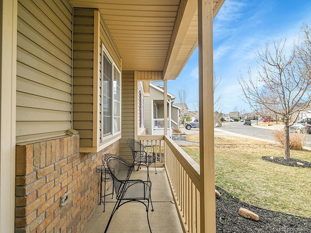 balcony featuring a porch and a residential view