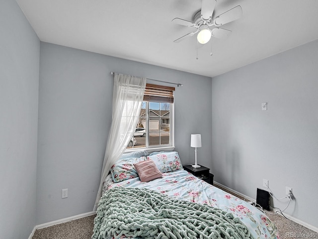 bedroom with carpet flooring, a ceiling fan, and baseboards