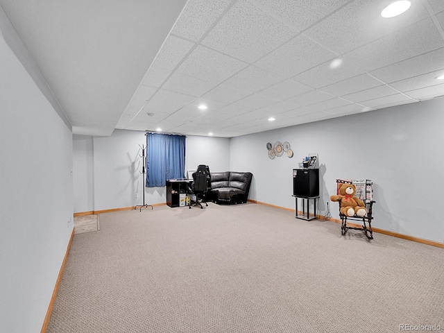 sitting room featuring carpet and baseboards