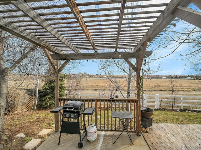 deck featuring fence, a pergola, and a grill