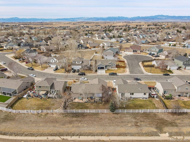 drone / aerial view featuring a residential view and a mountain view