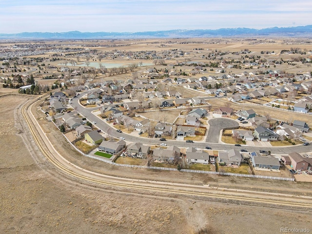 drone / aerial view with a mountain view and a residential view