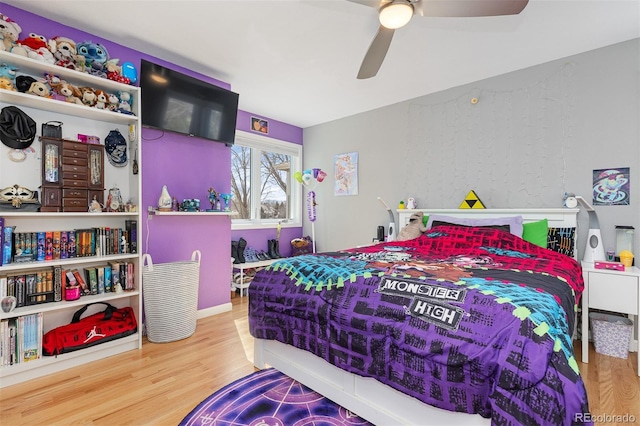 bedroom featuring ceiling fan and wood finished floors