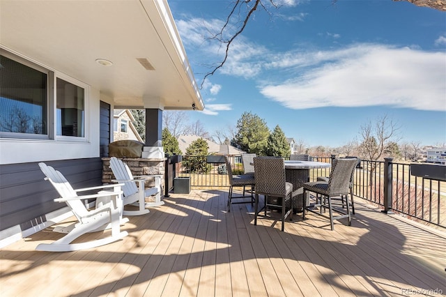 deck featuring outdoor dining area